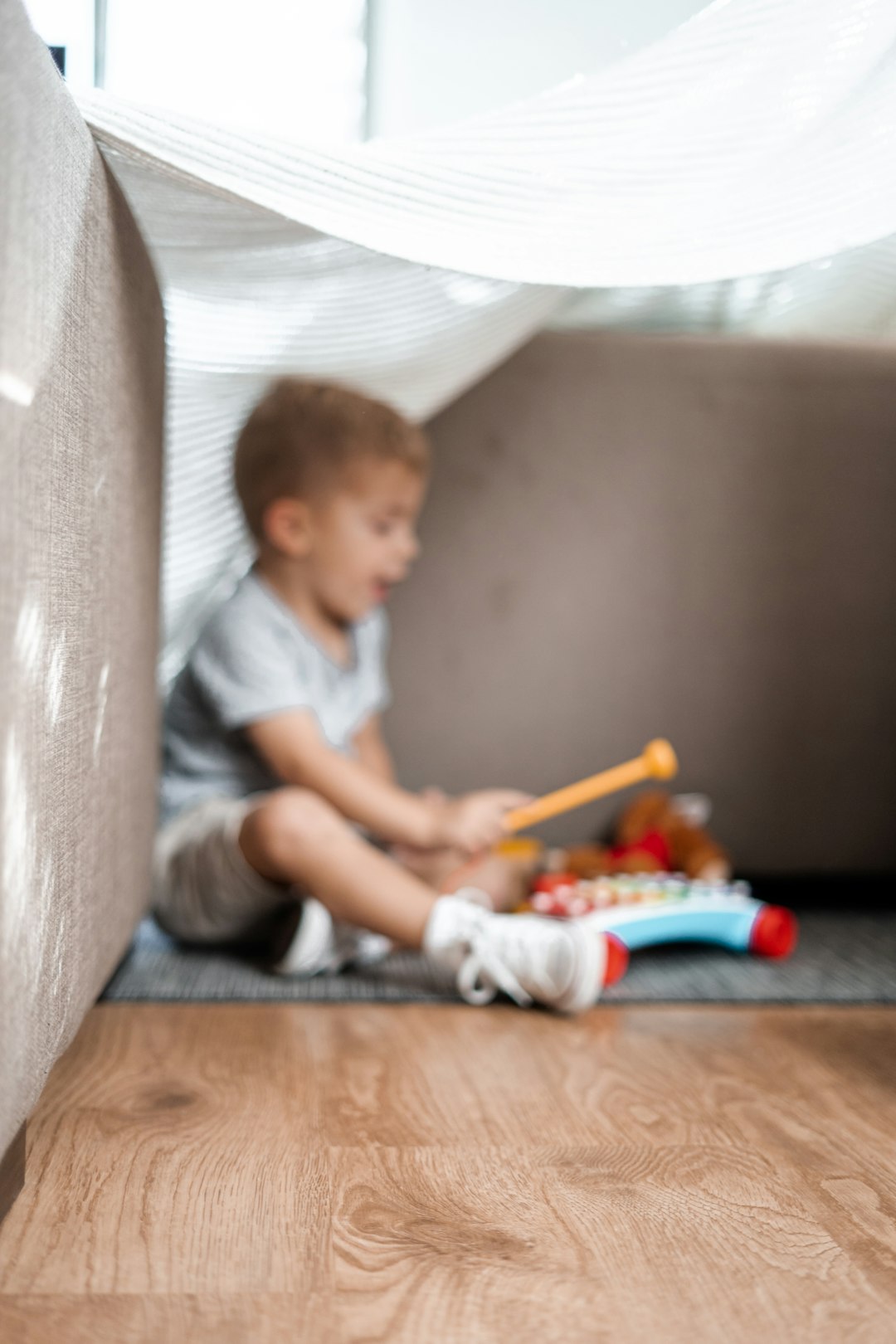 services-03 boy-playing-musical-instrument-toy-yskpklgen4a
